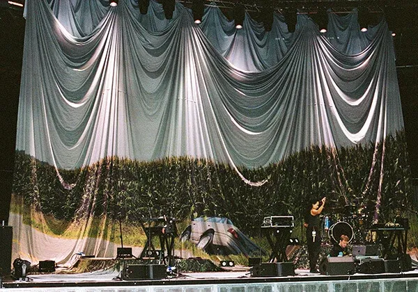 Large stage backdrop on display at a concert